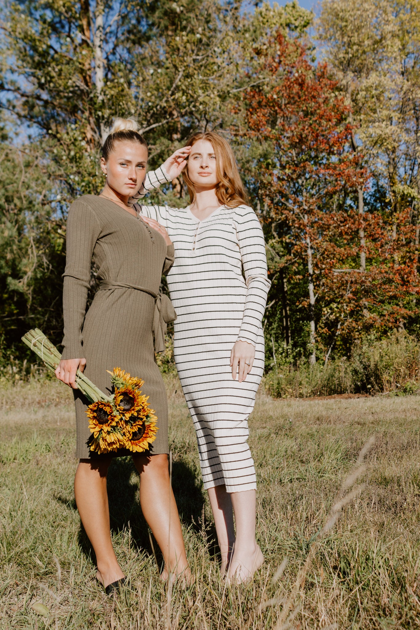 Beautiful Striped Sweater Dress in Oatmeal and black with buttons and ribbed design and sleeve detailing