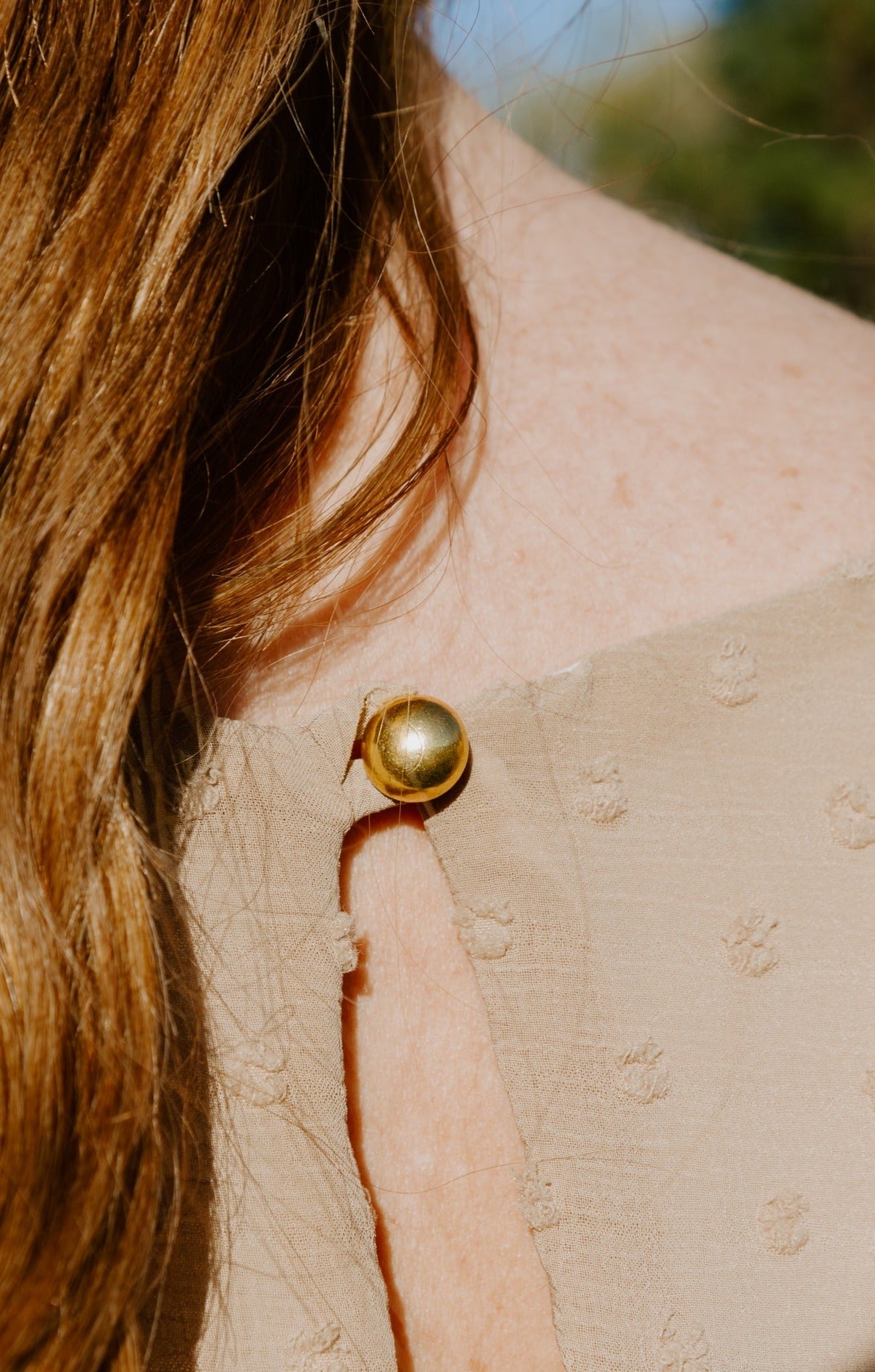 Beautiful midi swiss dot dress in vintage stone short sleeve with gold back closure button