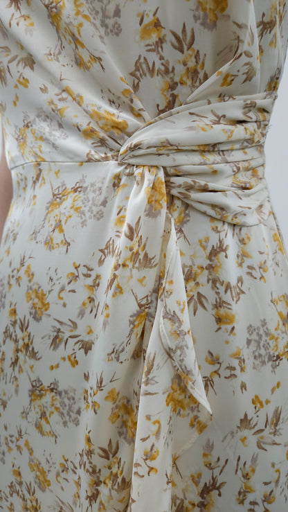 Beautiful ivory square neck midi dress with twist tie and elegant ruffle detail. Smocked back detail with zipper closure. 
