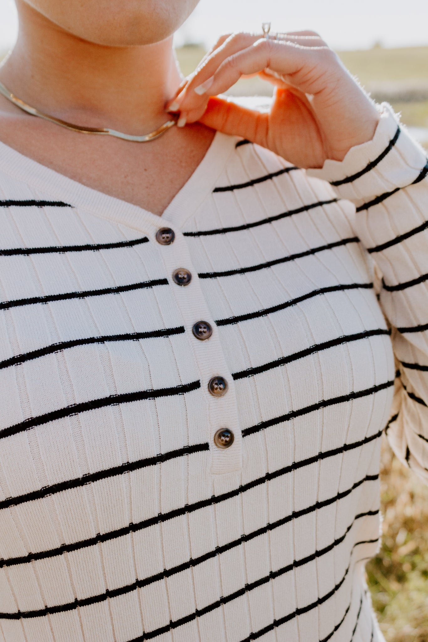 Beautiful Striped Sweater Dress in Oatmeal and black with buttons and ribbed design and sleeve detailing